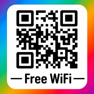 May include: A square sign featuring a black and white QR code centered on a white background with rounded corners. Below the QR code, the text reads Free WiFi in a black sans-serif font. The entire sign is set against a vibrant rainbow gradient.