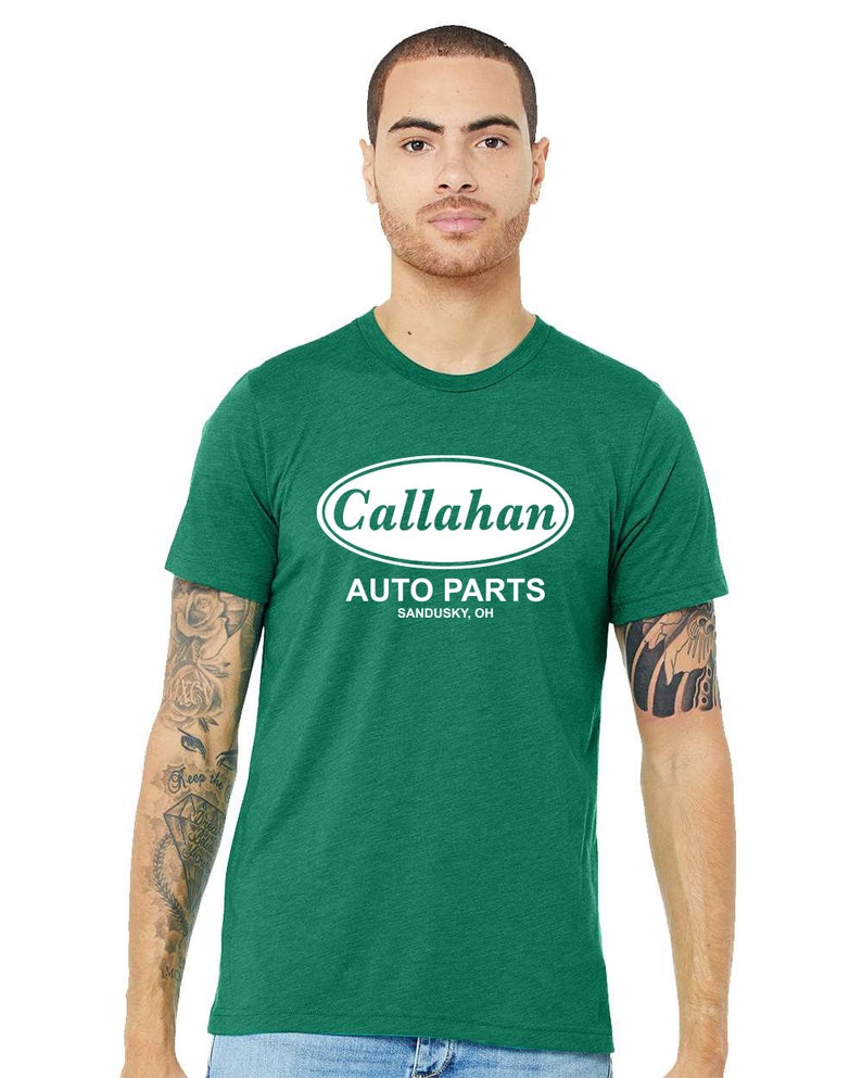 May include: A green t-shirt with a white oval logo that says "Callahan Auto Parts Sandusky, OH".