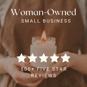 May include: A woman's hands hold a lit candle in a clear glass jar. The candle is surrounded by five white stars, and the text "Woman-Owned Small Business" and "500+ Five Star Reviews" is displayed below.