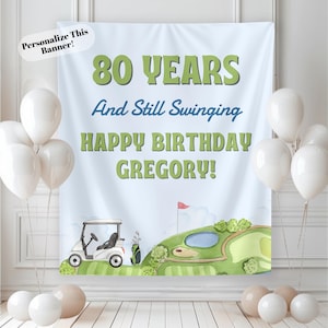 May include: A light blue banner with the text "80 YEARS And Still Swinging HAPPY BIRTHDAY GREGORY!" and a golf course illustration. White balloons are arranged around the banner. The banner is designed to be personalized.