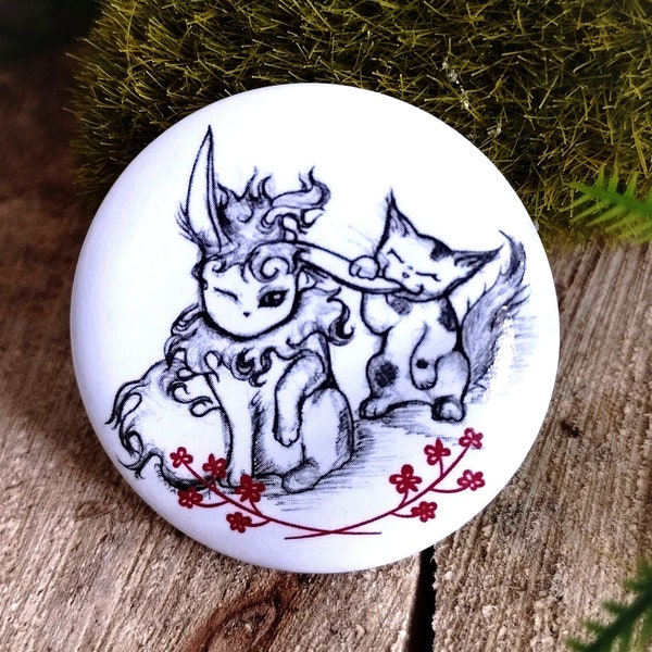 Pyroli badge and cat friend