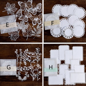 Puede incluir: Conjunto de 10 servilletas de papel blancas con intrincados dise&ntilde;os de encaje. Las servilletas est&aacute;n empaquetadas en bolsas de pl&aacute;stico transparentes con el texto "精致生活" en negro.