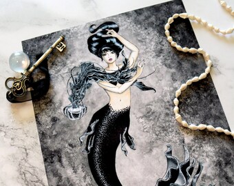 May include: Black and white illustration of a mermaid with long black hair and a black tail. The mermaid is holding a jellyfish in her hand. The background is a dark gray watercolor wash.