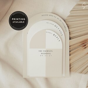 May include: A wedding invitation with a modern arch design in beige and white. The invitation features the text "Please join us as we celebrate" and "The Emerson Wedding 09 21 21".