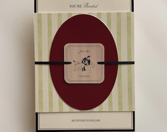 May include: A rectangular invitation card featuring a cream background with black borders, a light green striped band, and a deep red oval overlay. A square tag with rounded corners displays a black illustration of a couple and the text "Join Us" and "09.25.2026". The card includes the text "YOU'RE Invited" and "RECEPTION TO FOLLOW".