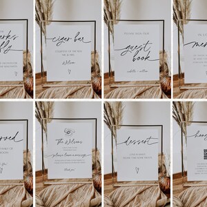 Peut inclure: Huit cadres en acrylique transparent avec des pancartes blanches &agrave; l'int&eacute;rieur. Les pancartes comportent du texte en calligraphie noire et de petites illustrations de c&oelig;urs. Les pancartes indiquent : "Set the sparks fly", "Cigar Bar", "Please sign our guest book", "In loving memory", "Reserved for the family of the groom", "The Wilsons please leave a message", "Dessert", and "Honeymoon Fund".