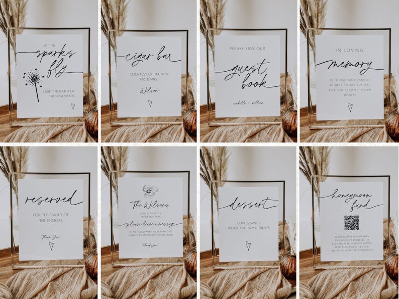 Peut inclure: Huit cadres en acrylique transparent avec des pancartes blanches &agrave; l'int&eacute;rieur. Les pancartes comportent du texte en calligraphie noire et de petites illustrations de c&oelig;urs. Les pancartes indiquent : "Set the sparks fly", "Cigar Bar", "Please sign our guest book", "In loving memory", "Reserved for the family of the groom", "The Wilsons please leave a message", "Dessert", and "Honeymoon Fund".