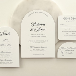 May include: Elegant wedding invitation suite with arched and rounded cards. The main card announces the wedding of Vivienne & Asher on September 21, 2025. Additional cards include details, RSVP, and a thank you message.