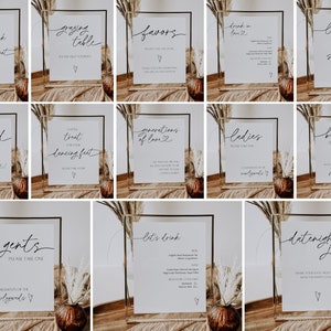 Peut inclure: Un ensemble de 12 panneaux en acrylique transparent avec du texte en calligraphie noire. Les panneaux sont parfaits pour un mariage ou un autre &eacute;v&eacute;nement sp&eacute;cial. Le texte sur les panneaux comprend "Prenez un verre, prenez place", "Table de grignotage", "Faveurs", "Buvez d'amour", "Collation de fin de soir&eacute;e", "On se fait griller", "Nommez un r&eacute;gal pour vos pieds dansants", "Des g&eacute;n&eacute;rations d'amour", "Mesdames, veuillez prendre un", "Souffle de bulles", "Messieurs, veuillez prendre un", et "Jardini&egrave;re de rendez-vous galant".