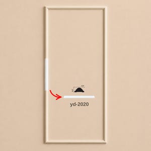May include: A rectangular light beige frame with a thin white trim piece. A red arrow points to the trim, which features a cross-section diagram showing dimensions of 0.4 inches by 0.8 inches. The text yd-2020 is printed below the diagram.