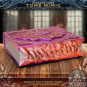 May include: A purple and gold storage tome with the text "STORAGE TOME TOME MIMIC". The book has a detailed design and a jaw-like opening with sharp teeth. The text "PERFECT FOR STORING CARDS, DICE, MINIS AND MORE!" is also visible.