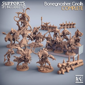 May include: A collection of detailed miniature figures, including warriors, beasts, and terrain elements. The figures are in a neutral color, with the text "Bonegnasher Gnolls COMPLETE" and "SUPPORTS INCLUDED" visible. The set appears to be designed for tabletop gaming.