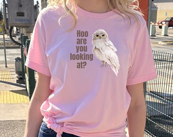 May include: A pink t-shirt with a white owl graphic and the text "Hoo are you looking at?"