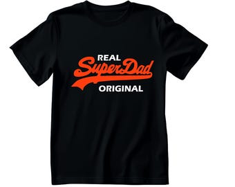 May include: Black t-shirt with the words "REAL SuperDad ORIGINAL" in a bold orange and white design. The text is stylized with a retro font, making it a great gift for Father's Day or any day.