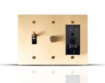 Toggle, dimmer & outlet with solid brass wall plate