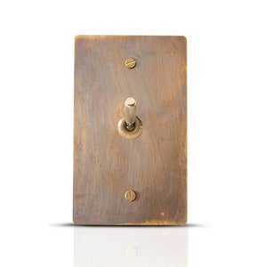 Aged brass knurled toggle light switch