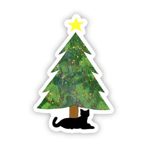 May include: A green Christmas tree with a yellow star on top and a black cat sitting under it.