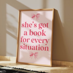 pink wall art featuring the quote She’s Got a Book for Every Situation with feminine bow accents, perfect for book lovers, reading nooks, and cozy decor. Book Merch, Harry Styles Merch, Bookish Prints, Coquette Decor,Aestethic wall art