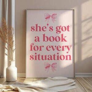 pink wall art featuring the quote She’s Got a Book for Every Situation with feminine bow accents, perfect for book lovers, reading nooks, and cozy decor. Book Merch, Harry Styles Merch, Bookish Prints, Coquette Decor,Aestethic wall art