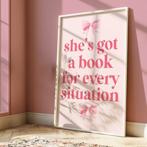 pink wall art featuring the quote She’s Got a Book for Every Situation with feminine bow accents, perfect for book lovers, reading nooks, and cozy decor. Book Merch, Harry Styles Merch, Bookish Prints, Coquette Decor,Aestethic wall art