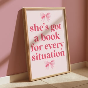 pink wall art featuring the quote She’s Got a Book for Every Situation with feminine bow accents, perfect for book lovers, reading nooks, and cozy decor. Book Merch, Harry Styles Merch, Bookish Prints, Coquette Decor,Aestethic wall art
