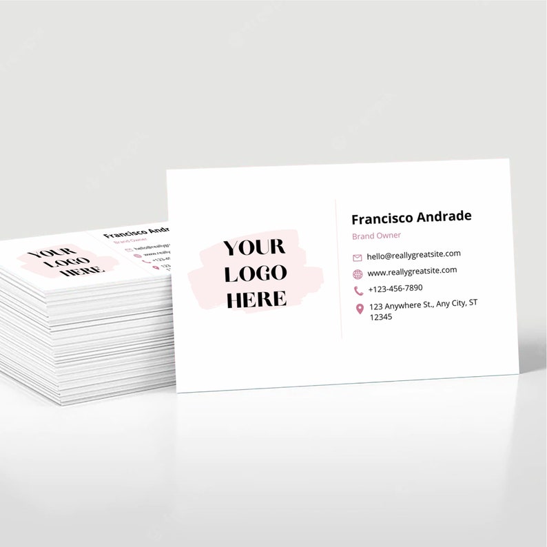 May include: A white business card with a pink brushstroke design and the text "YOUR LOGO HERE". The card includes the name "Francisco Andrade", the title "Brand Owner", and contact information including an email address, website, phone number, and address.