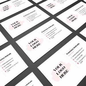 May include: A white business card with a pink and white logo that says "YOUR LOGO HERE". The card has the name "Francisco Andrade" and contact information including an email address, website, phone number, and address.