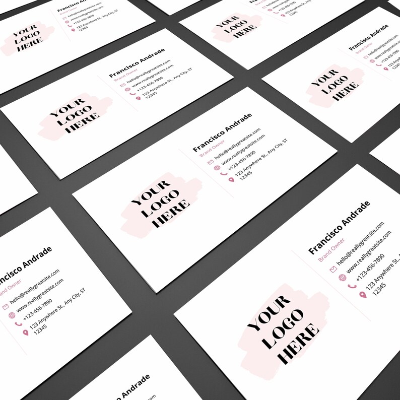 May include: A white business card with a pink and white logo that says "YOUR LOGO HERE". The card has the name "Francisco Andrade" and contact information including an email address, website, phone number, and address.