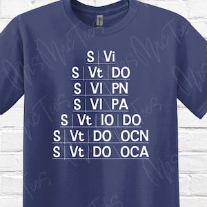 May include: Navy blue t-shirt with a white graphic design. The design features a pyramid of text, with the words "S Vi", "S Vt DO", "S Vi PN", "S Vi PA", "S Vt IO DO", "S Vt DO OCN", and "S Vt DO OCA".