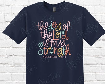 May include: Navy blue t-shirt with a colorful graphic that reads "the joy of the Lord is my strength" with the scripture reference "Nehemiah 8:10".