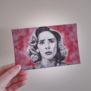 May include: A black and white drawing of a woman with red eyes against a red watercolor background.