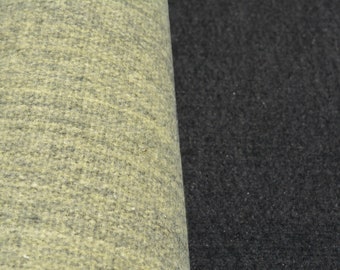 May include: Close-up of two fabric swatches, one a light beige with a subtle texture and the other a dark charcoal gray with a slightly rougher texture.