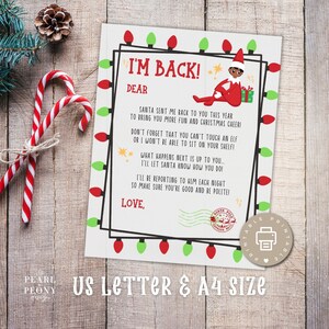Può includere: Una lettera stampabile a tema natalizio con il testo "I'M BACK!" e un'illustrazione di un elfo. La lettera è decorata con luci rosse e verdi e contiene il testo "US LETTER & A4 SIZE". Bastoncini di zucchero e una pigna sono sullo sfondo.