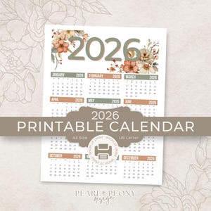 May include: A printable 2026 calendar with a floral design. The calendar features a neutral color palette with months listed across the top and a large "2026" at the top. The words "Printable Calendar" are in a banner across the middle.