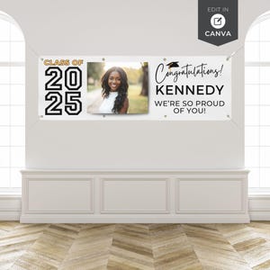 May include: A white banner with the text "CLASS OF 2025" in black and gold. A photo of a smiling woman is in the center. The banner also reads "Congratulations! KENNEDY WE'RE SO PROUD OF YOU!"