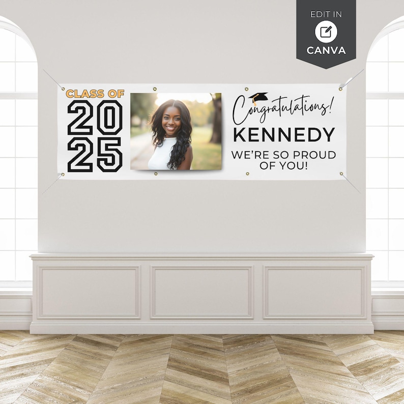 May include: A white banner with the text "CLASS OF 2025" in black and gold. A photo of a smiling woman is in the center. The banner also reads "Congratulations! KENNEDY WE'RE SO PROUD OF YOU!"