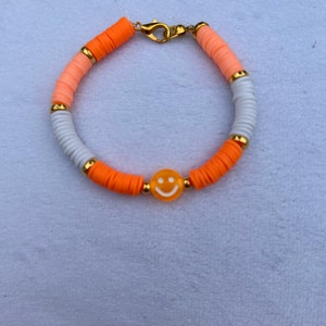 Orange smiley face bracelet