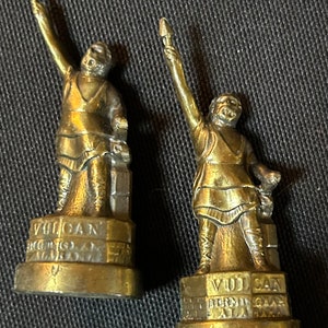 Two vintage bronze metal Vulcan God bottle stoppers