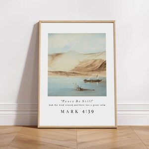 May include: A framed print with a watercolor painting of a boat on a lake with mountains in the background. The print includes the text "Peace Be Still" and "And the wind ceased, and there was a great calm. MARK 4:39".