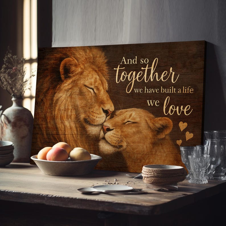 May include: A wood-grain background with a lion and lioness couple. The text reads "And so together we have built a life we love".