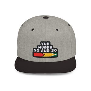 May include: A gray and black baseball cap with a red, yellow, and green patch that says "Yuh Mudda So And So".