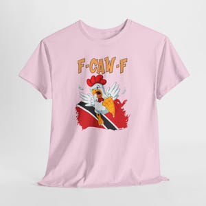 Model wearing Funny Trinidad T-Shirt outdoors, styled for everyday wear, humor gift for cricket fans in Trinidad. Trinbago Knight Rider CPL shirt. Funny Fuck off Shirt. Subliminal message for Guyanese fans