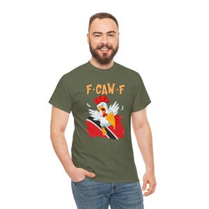 Model wearing Funny Trinidad T-Shirt outdoors, styled for everyday wear, humor gift for cricket fans in Trinidad. Trinbago Knight Rider CPL shirt. Funny Fuck off Shirt. Subliminal message for Guyanese fans