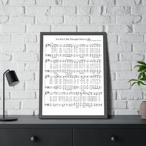 May include: Black and white printable sheet music for the hymn "Yet Not I, But Through Christ in Me". The music includes the lyrics and musical notation.