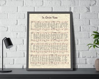 May include: A vintage-style print of a hymn sheet with the title "In Christ Alone". The sheet music features the lyrics and musical notation for the hymn. The paper has a cream color and a slightly textured surface.