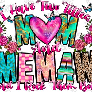 May include: A colorful graphic design with the text "I Have Two Titles Mom And Memaw And I Rock Them Both". The design features a pink heart, butterflies, and floral accents.