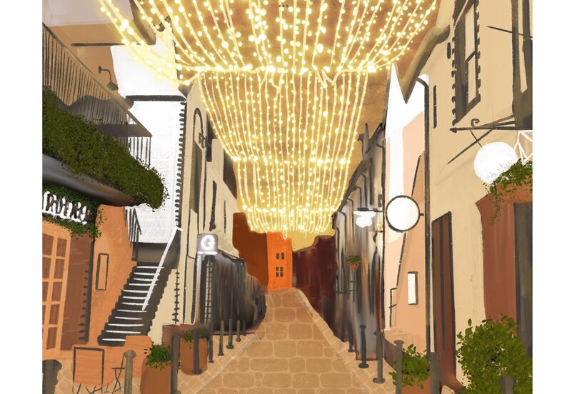 May include: A narrow, cobblestone street lined with buildings, decorated with twinkling string lights overhead. The street is empty, with a few potted plants and a glimpse of a red building in the distance.