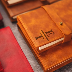 a brown leather book with arabic writing on it