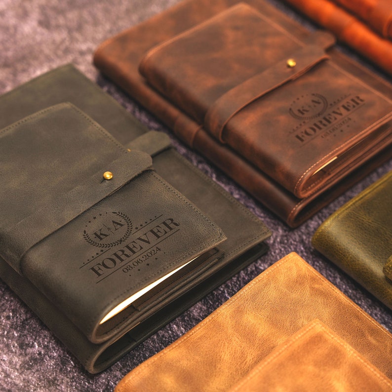 a group of leather notebooks sitting on top of a carpet