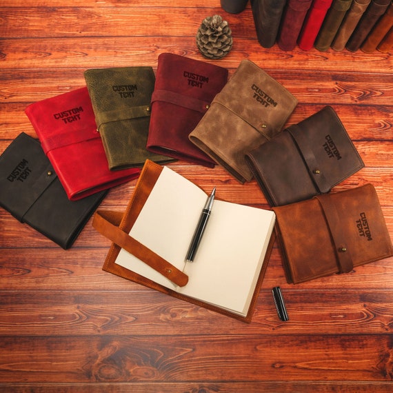 A refillable A5 leather journal with a monogrammed cover that actually gets better with age — the kind of gift that outlasts the first notebook.